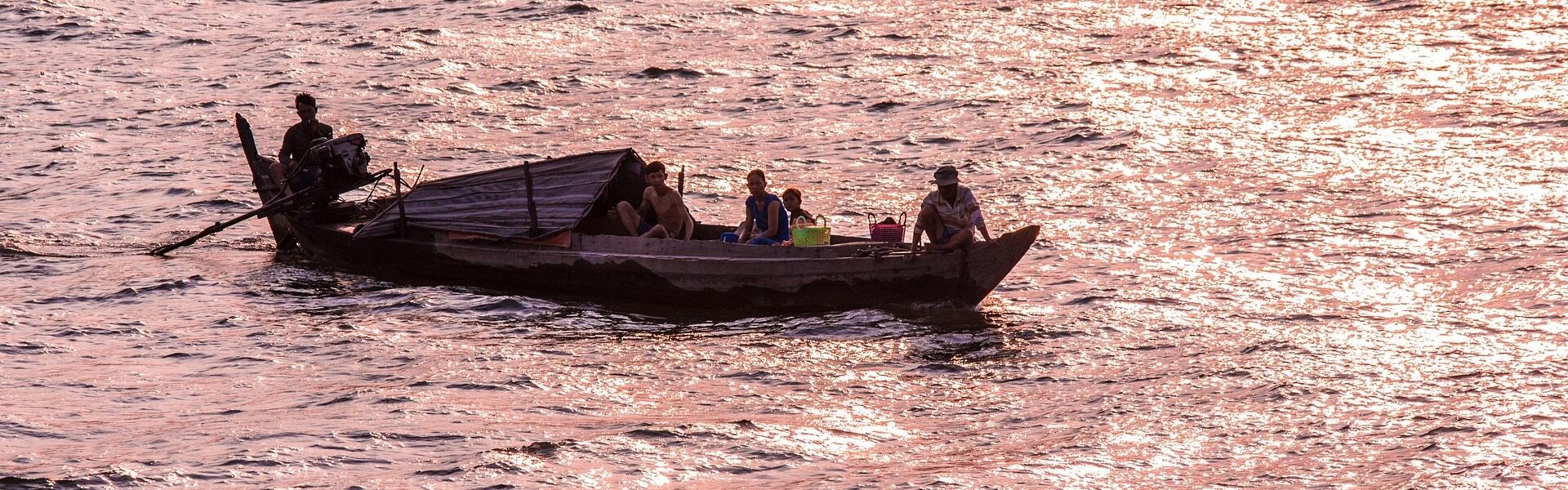 Panoramic view of Chiang Khong’s Mekong shores for a scenic Chiang Khong Tours banner by Legend Travel Group.